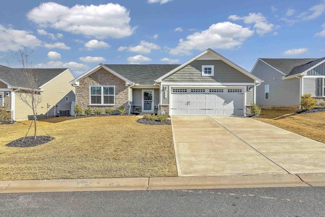 view of front facade featuring a garage and a front lawn