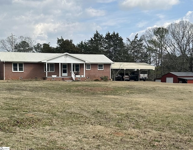 single story home with a front lawn, a carport, and a porch