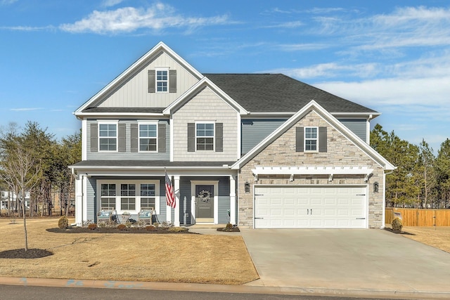 view of front of property featuring a garage and a porch