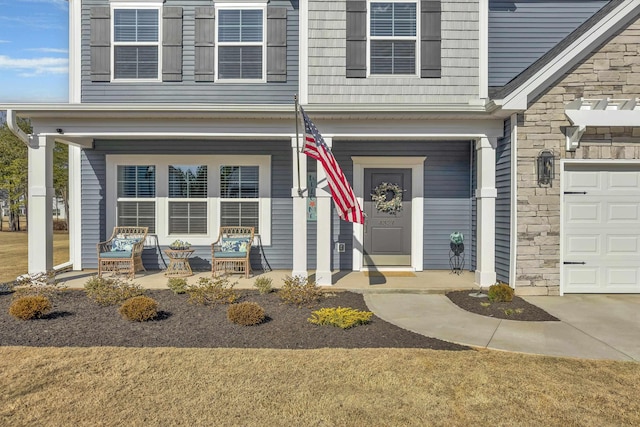 view of exterior entry with a garage