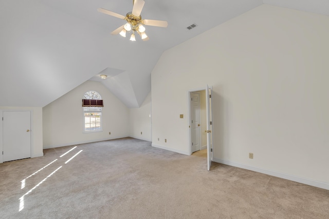 bonus room with vaulted ceiling, light colored carpet, and ceiling fan