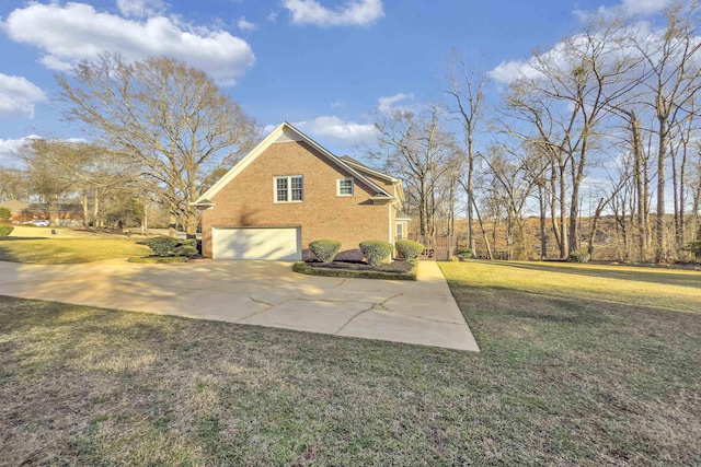 view of home's exterior featuring a garage and a yard