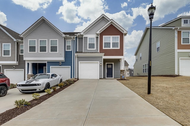 view of property with a garage and a front yard