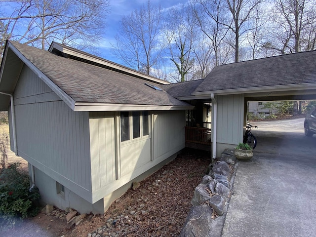 view of property exterior featuring a carport