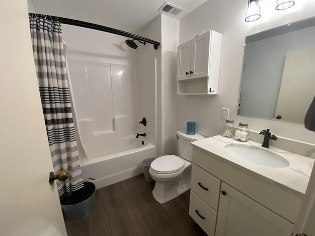 full bathroom featuring vanity, wood-type flooring, toilet, and shower / bath combo with shower curtain