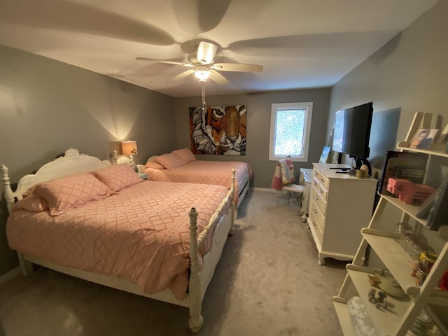 bedroom featuring light colored carpet and ceiling fan