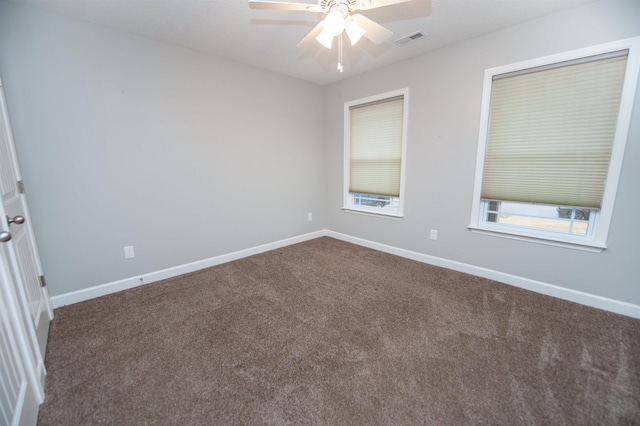 spare room featuring carpet flooring and ceiling fan