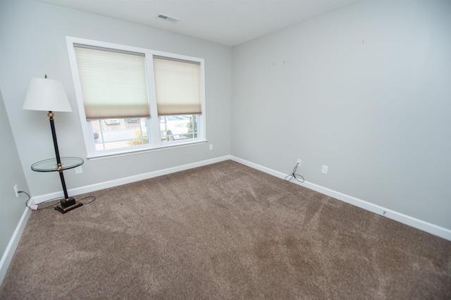 unfurnished room with carpet floors