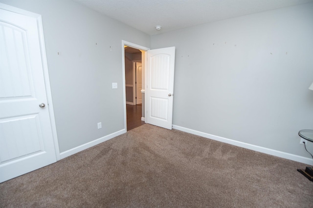 unfurnished bedroom with carpet