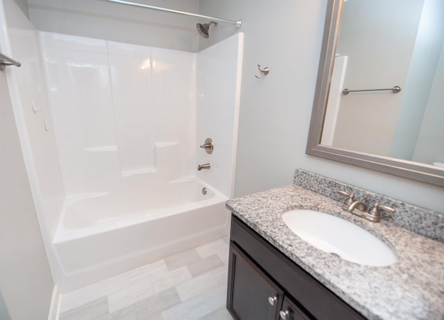 bathroom featuring vanity and bathing tub / shower combination