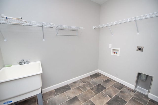 clothes washing area featuring washer hookup, hookup for an electric dryer, and sink