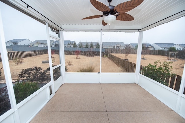 sunroom featuring a wealth of natural light and ceiling fan