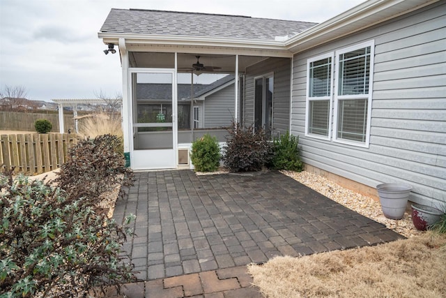 view of patio / terrace with ceiling fan, a pergola, and a sunroom