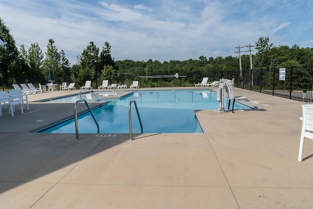 view of pool featuring a patio