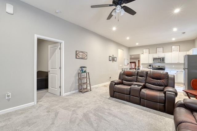 living room with light carpet and ceiling fan