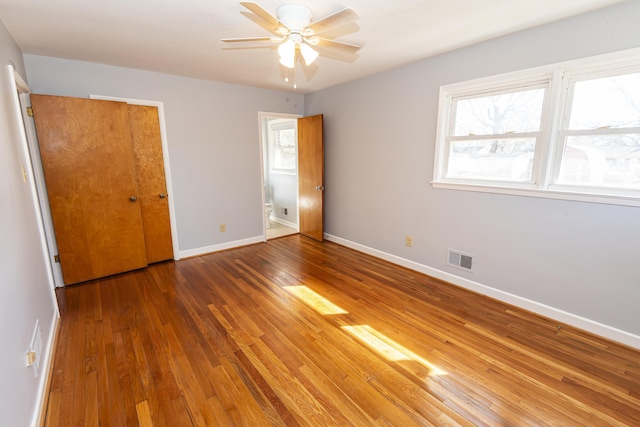 unfurnished bedroom with hardwood / wood-style floors and ceiling fan