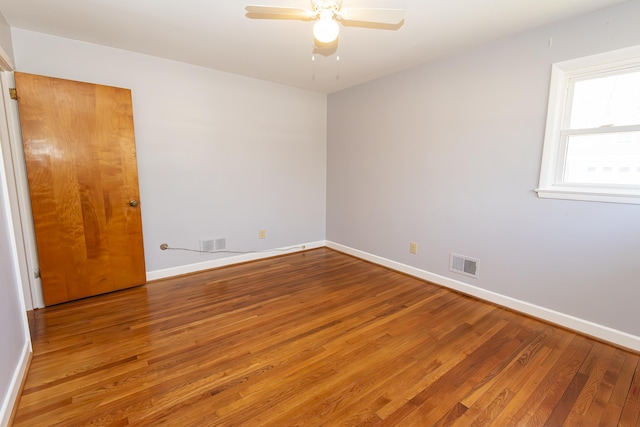 empty room with wood-type flooring and ceiling fan