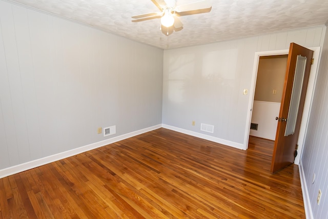 spare room featuring hardwood / wood-style floors, a textured ceiling, and ceiling fan