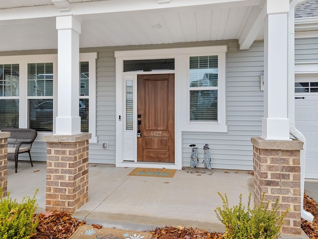 doorway to property with a porch