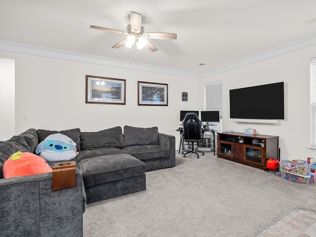 carpeted living room with ceiling fan and ornamental molding
