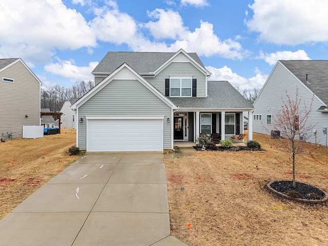 view of front of property with a garage and covered porch