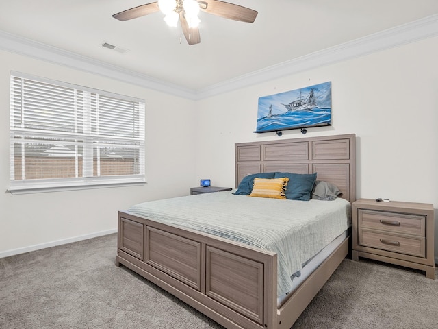 bedroom with ceiling fan, ornamental molding, and light carpet