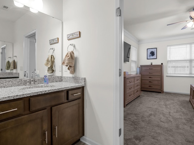 bathroom featuring vanity, ornamental molding, and ceiling fan