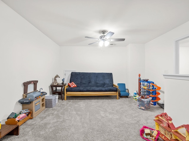 rec room with carpet flooring and ceiling fan