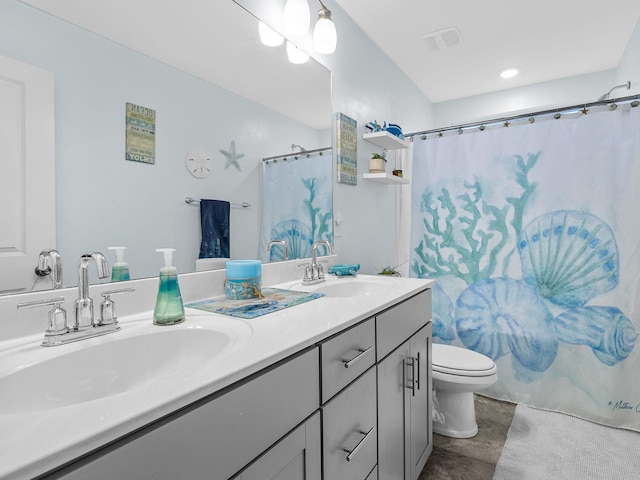 full bathroom featuring vanity, shower / bath combination with curtain, and toilet