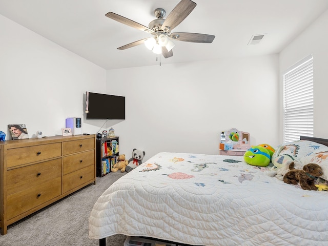 bedroom with light carpet and ceiling fan