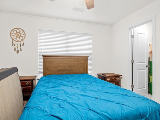 bedroom with crown molding and ceiling fan
