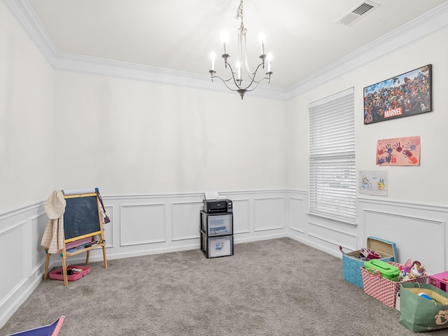 recreation room with crown molding, light carpet, and a notable chandelier