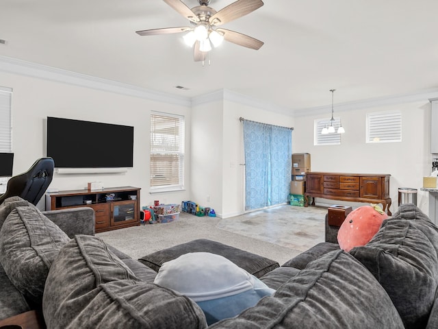 living room with ornamental molding and ceiling fan