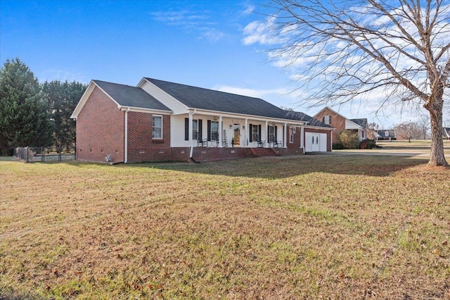 ranch-style house with a garage, a front lawn, and a porch