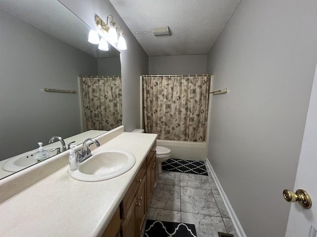 full bathroom featuring shower / bath combination with curtain, vanity, toilet, and a textured ceiling