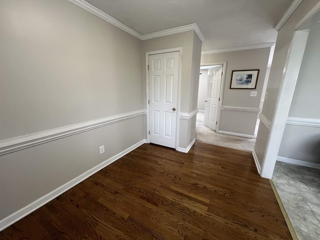 hall featuring crown molding and dark wood-type flooring