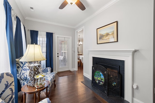 living room featuring ornamental molding, dark hardwood / wood-style floors, and ceiling fan