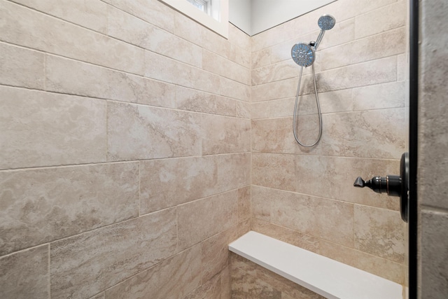 bathroom featuring a tile shower