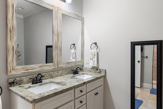 bathroom with crown molding and vanity