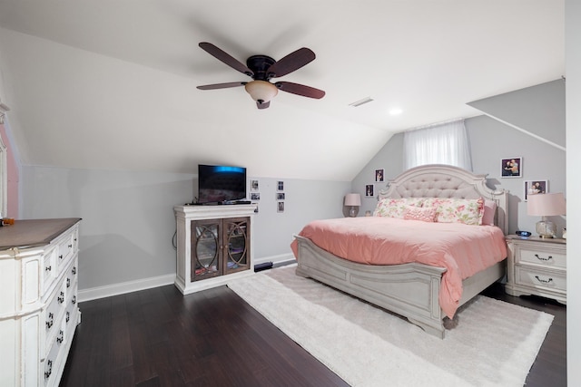 bedroom with lofted ceiling, dark hardwood / wood-style floors, and ceiling fan