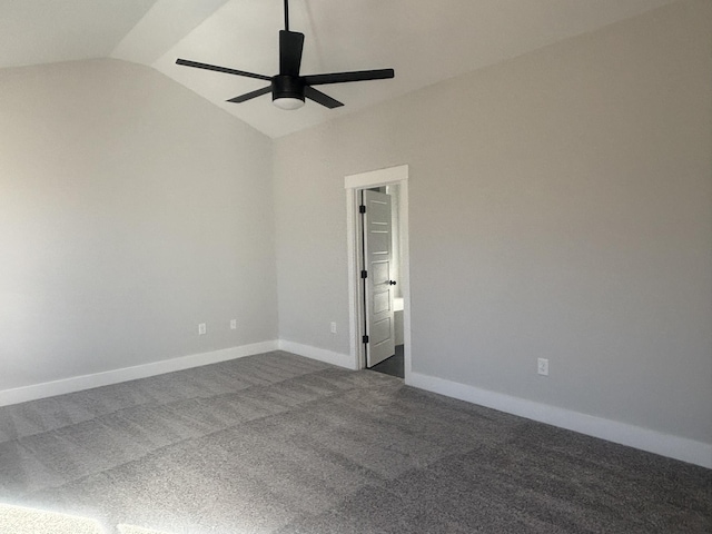 carpeted empty room with ceiling fan and vaulted ceiling