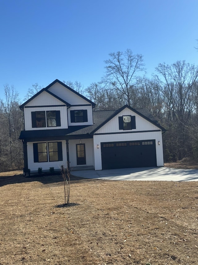 view of front of house featuring a garage and a front yard