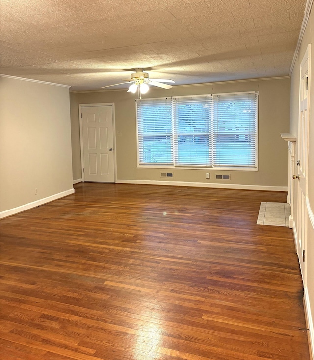 empty room with dark hardwood / wood-style flooring, crown molding, a textured ceiling, and ceiling fan