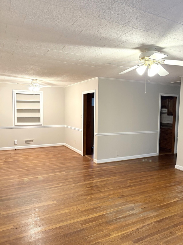 unfurnished room with ceiling fan, hardwood / wood-style flooring, and a textured ceiling