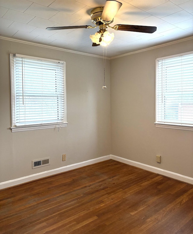 empty room featuring crown molding, ceiling fan, and dark hardwood / wood-style flooring