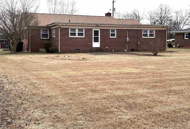 back of house with a yard