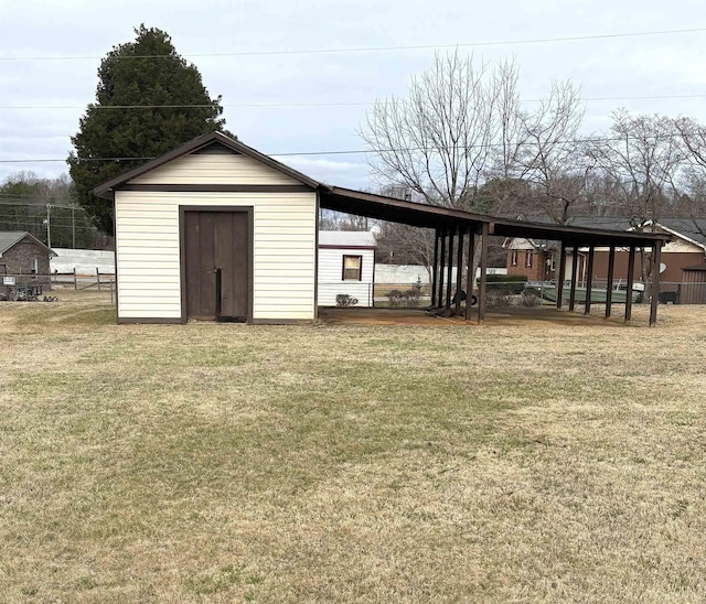 view of outbuilding featuring a yard