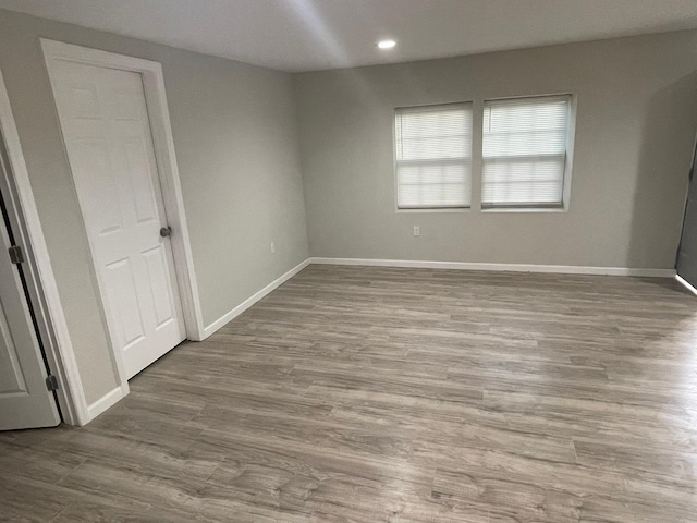 unfurnished bedroom featuring light wood-type flooring