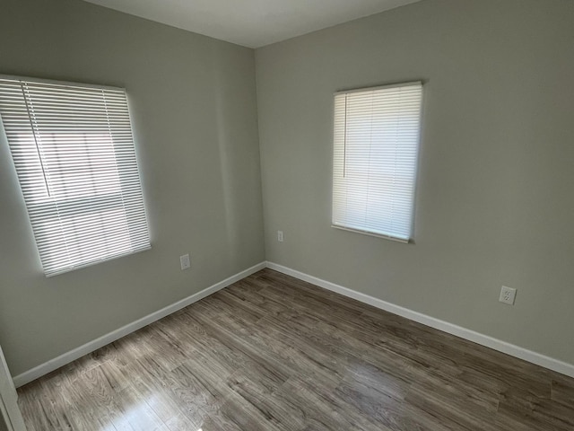 spare room featuring hardwood / wood-style flooring