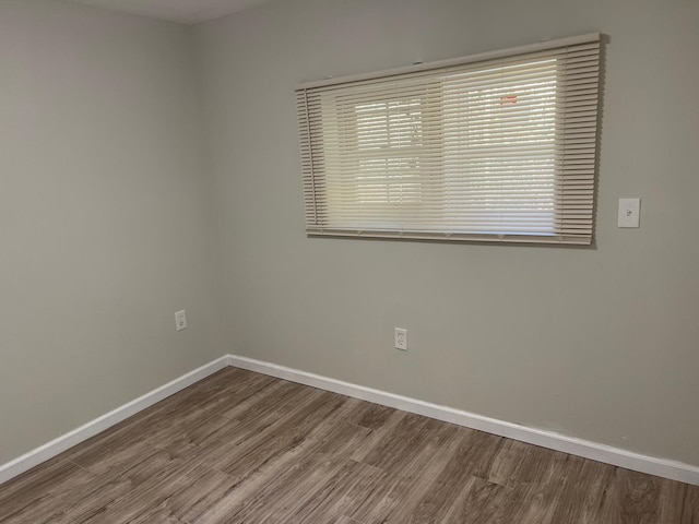 spare room with hardwood / wood-style floors